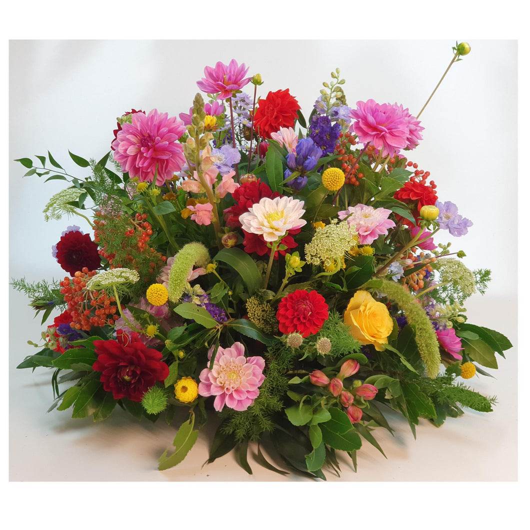 Blz. 9 | Rond gemengd afscheidsbloemstuk